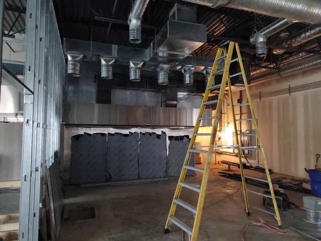 HVAC professional performing maintenance on commercial system